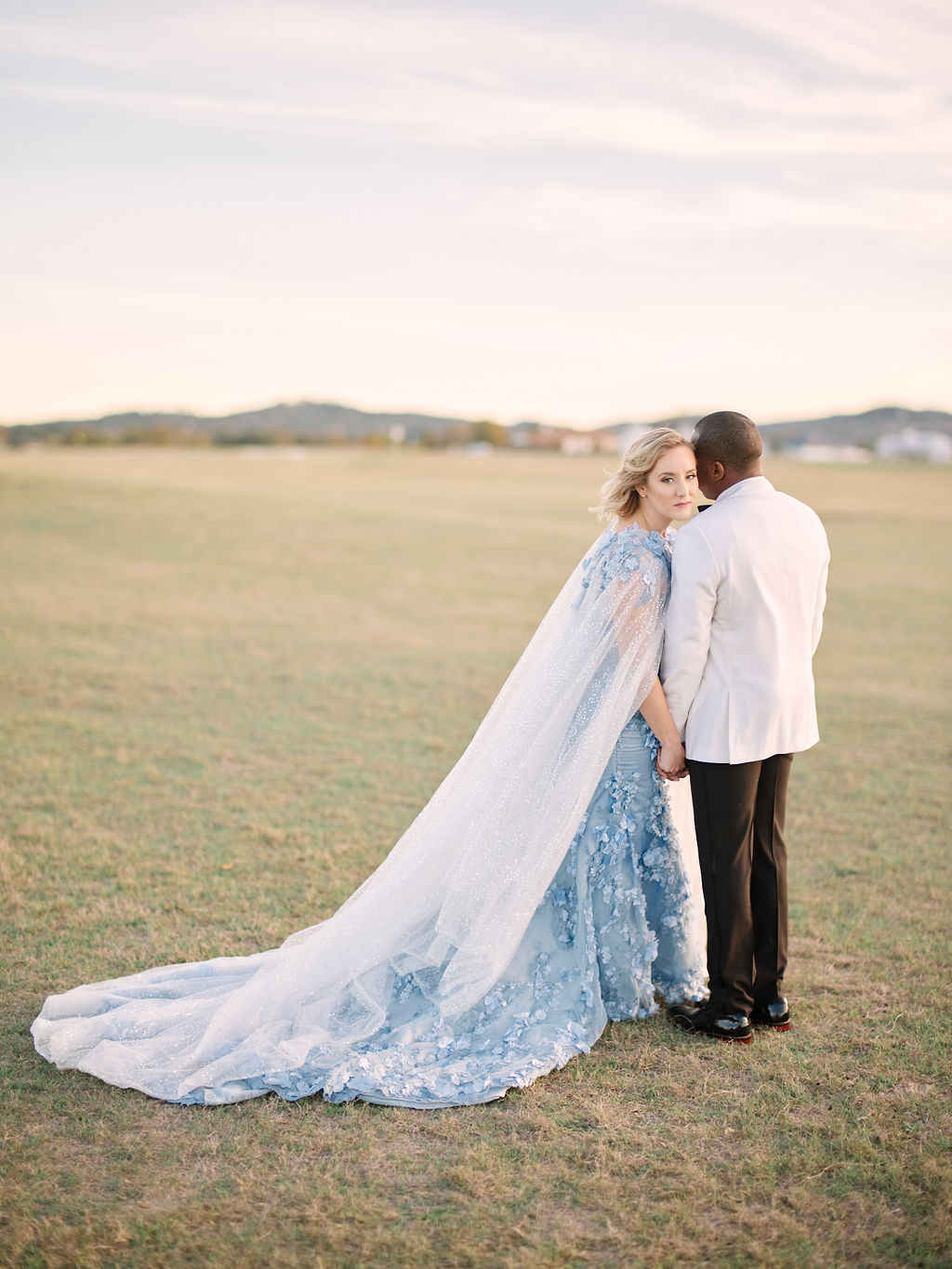 blue wedding dress and cape