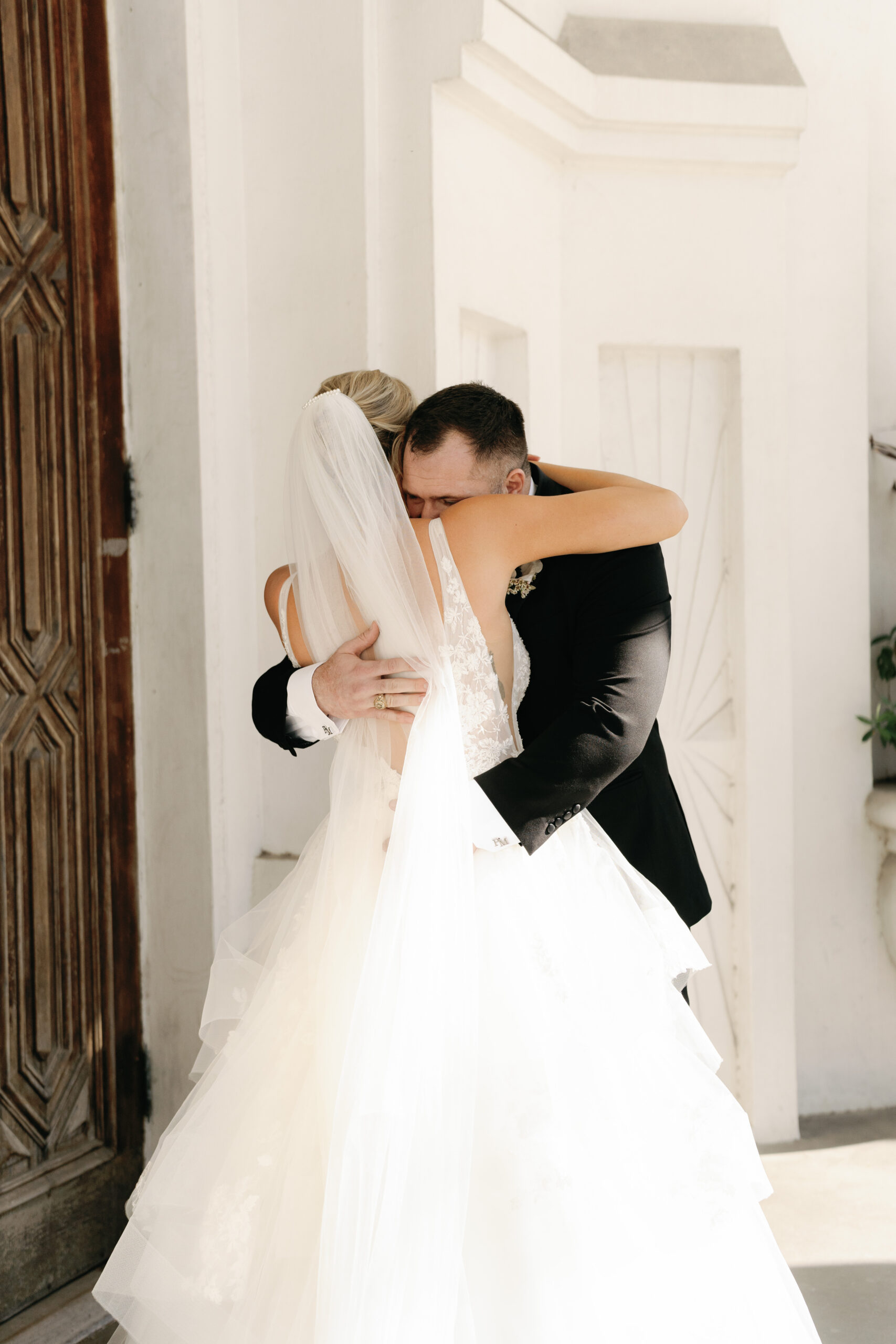 Bride and Groom in front of Sacred Heart church in galveston