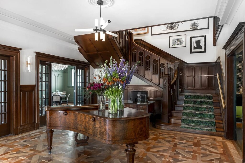 Grand staircase and piano at the La Columbe D'Or hotel in Houston