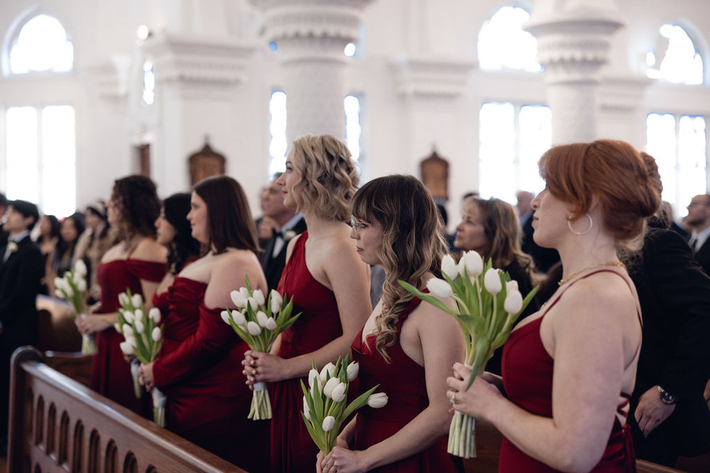 Sacred Heart Catholic Church wedding: Bridesmaids with their tulips bouquet.