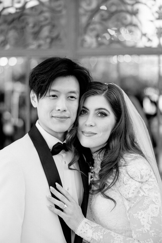 Close-up photo of the bride and groom side by side, captured outside Bryan Museum Conservatory.