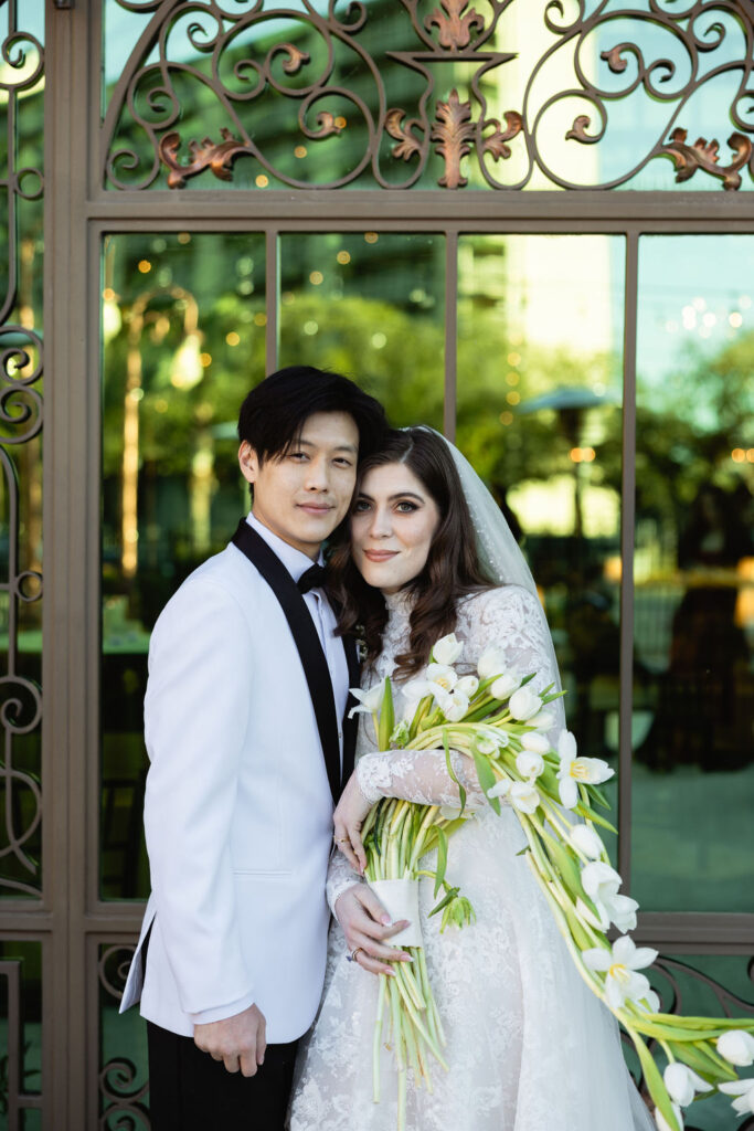 Bride and groom intimate photo, captured outside Bryan Museum Conservatory.