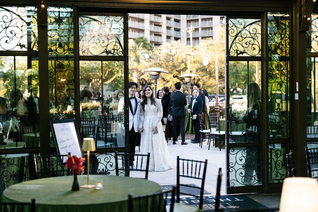 Groom and Bride stood outside the the Bryan Museum Conservatory.