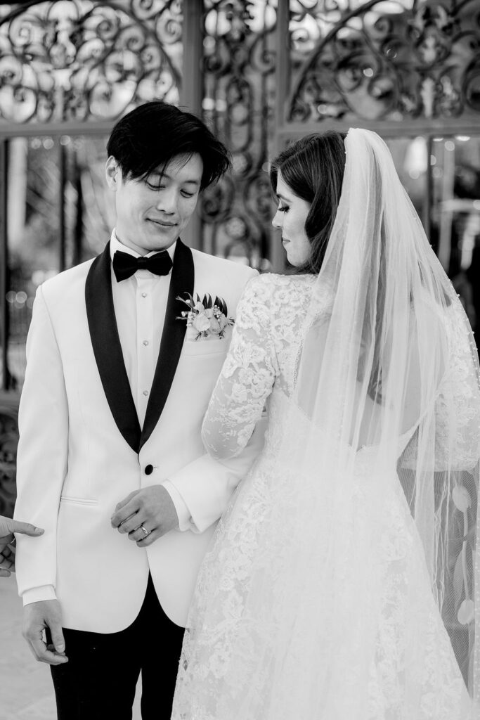 Photo of the bride and groom side by side, captured outside Bryan Museum Conservatory.