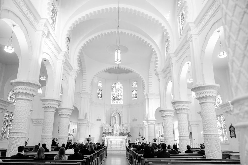 Sacred Heart Catholic Church Galveston wedding ceremony: Bride and groom at the altar.