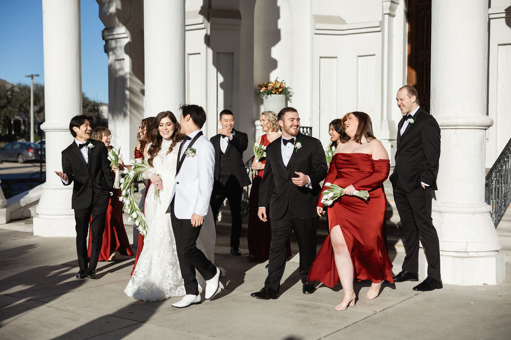 Wedding Party photo with the bride and groom, captured outside the Sacred Heart Catholic Church, before the Bryan Museum wedding.