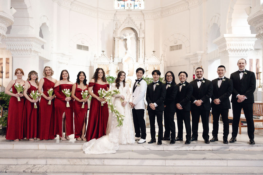 Wedding Party photo with the bride and groom, captured at Sacred Heart Catholic Church, before the Bryan Museum wedding.