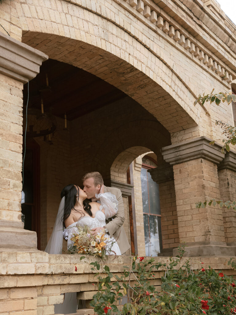 Bride and groom takes portraits for their Bryan Museum garden wedding