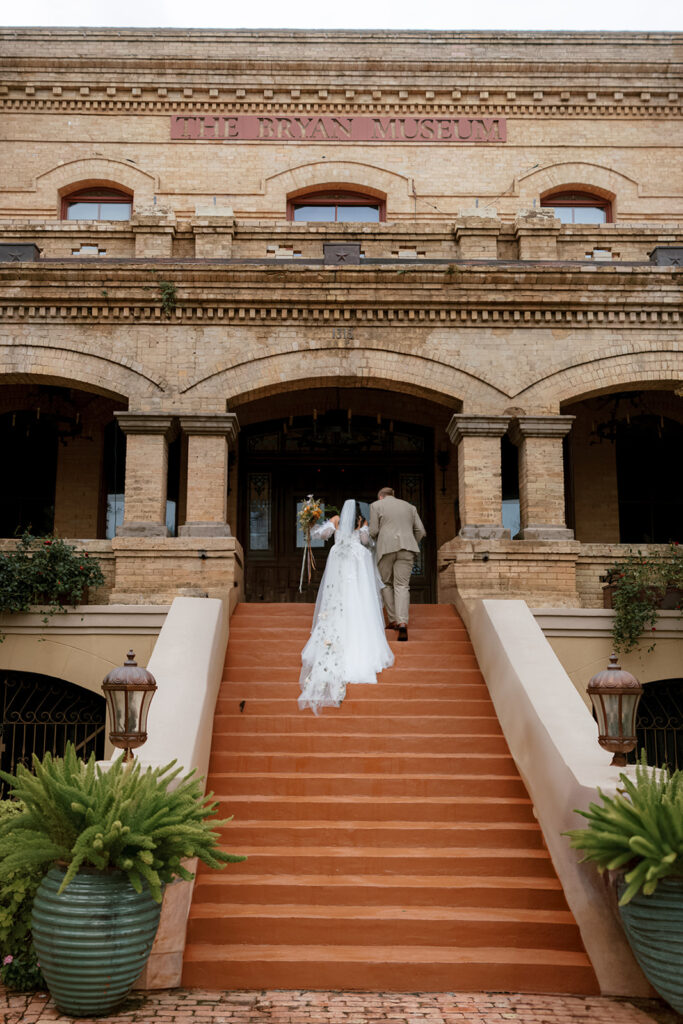 Bride and groom takes portraits for their Bryan Museum garden wedding