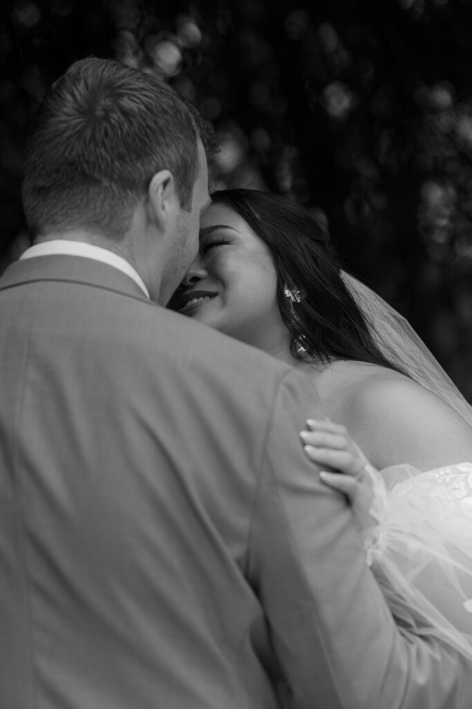 Bride and groom about to kiss at their Bryan Museum garden wedding