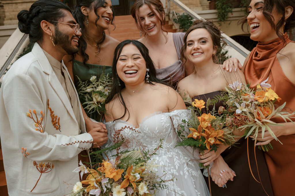 Wedding party takes photos for the Bryan Museum garden wedding