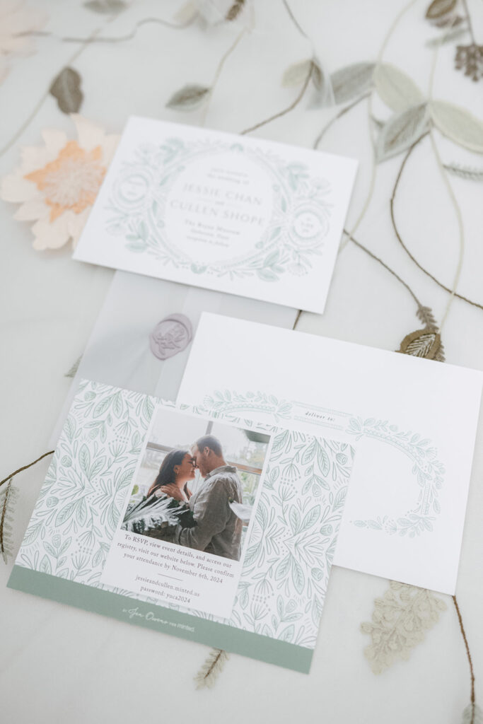 Flatlay photos of Jessie and Cullen's invitation suite of their Bryan Museum garden wedding.