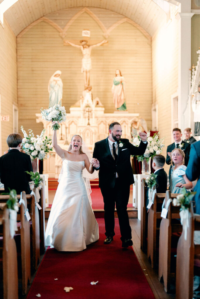 Bride and groom celebrates as newly weds at their Real Wedding at Galveston City National Bank Museum