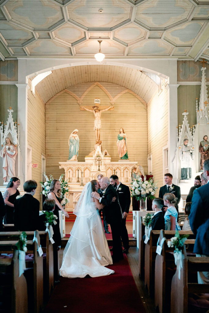 Bride and her father shares a moment during her Real Wedding at Galveston City National Bank Museum