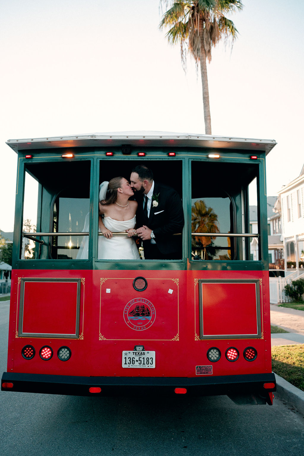 Bride and groom on a galveston trolley bus