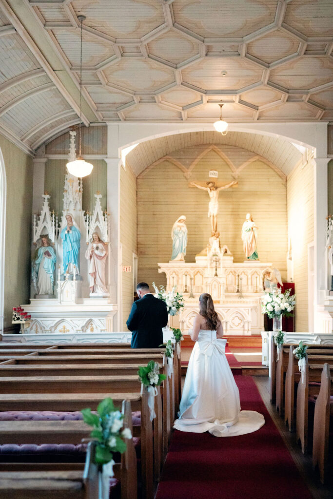 Bride walk towards the groom for their first look at their Real Wedding at Galveston City National Bank Museum