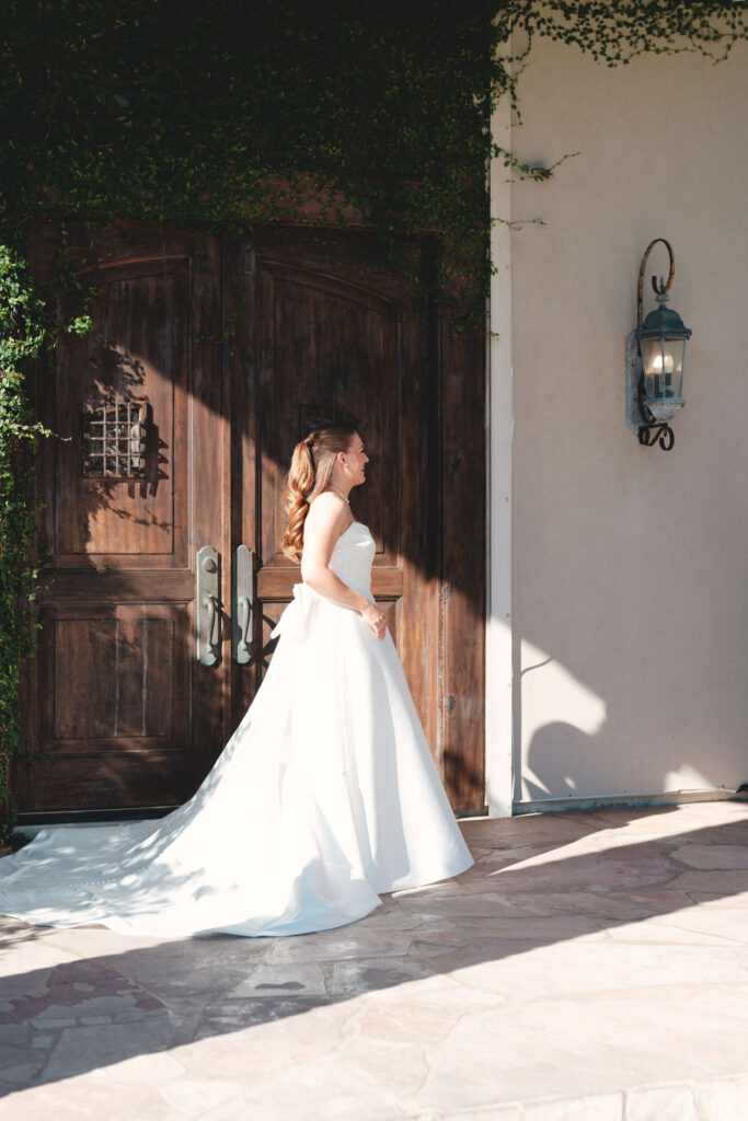 Real Wedding at Galveston City National Bank Museum: Bride takes a photo