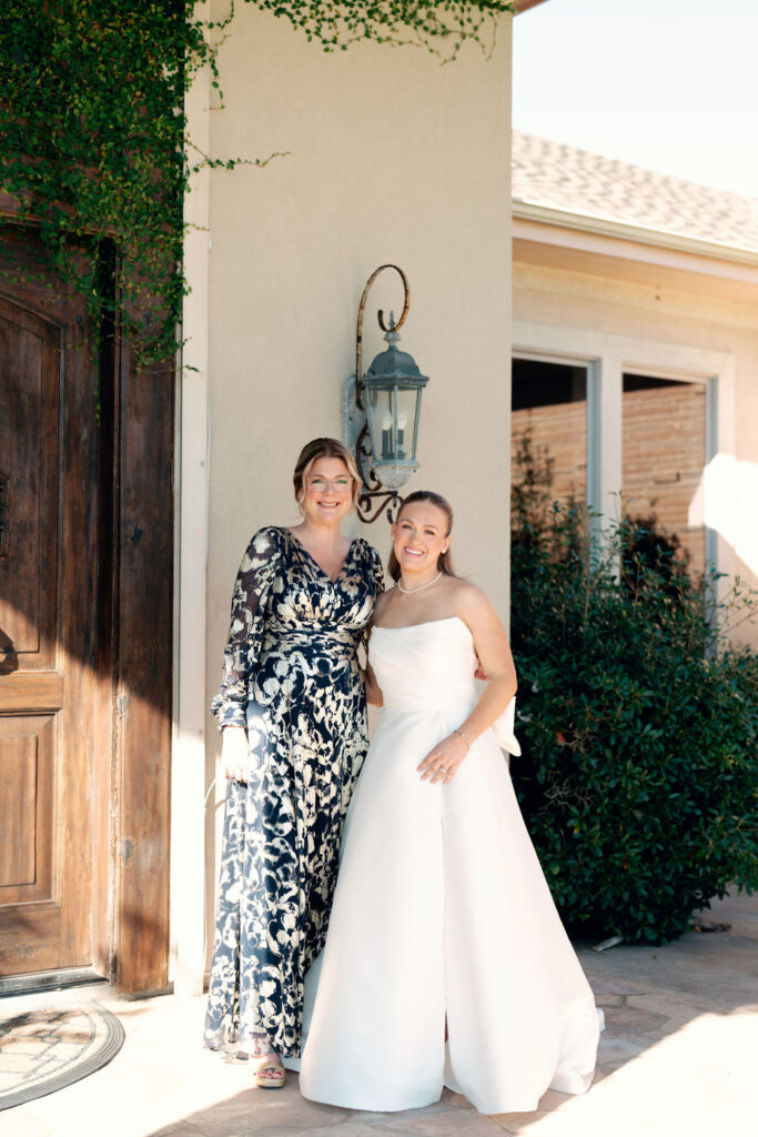 Real Wedding at Galveston City National Bank Museum: Bride takes a photo with a her relative.
