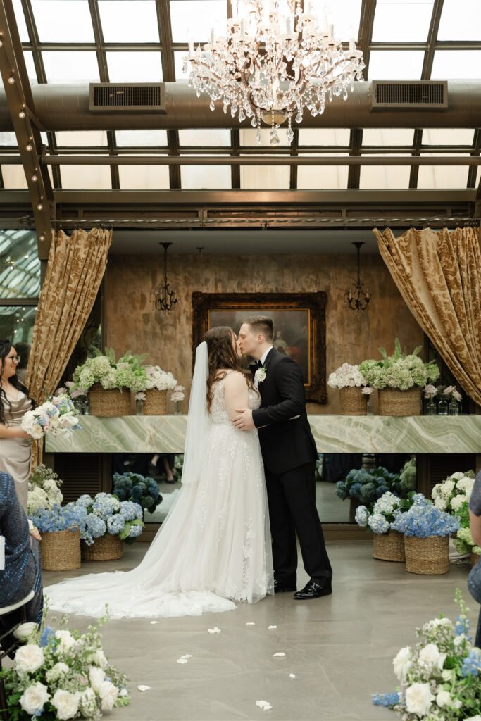Blue and green flowers in baskets for a wedding ceremony at the bryan museum
