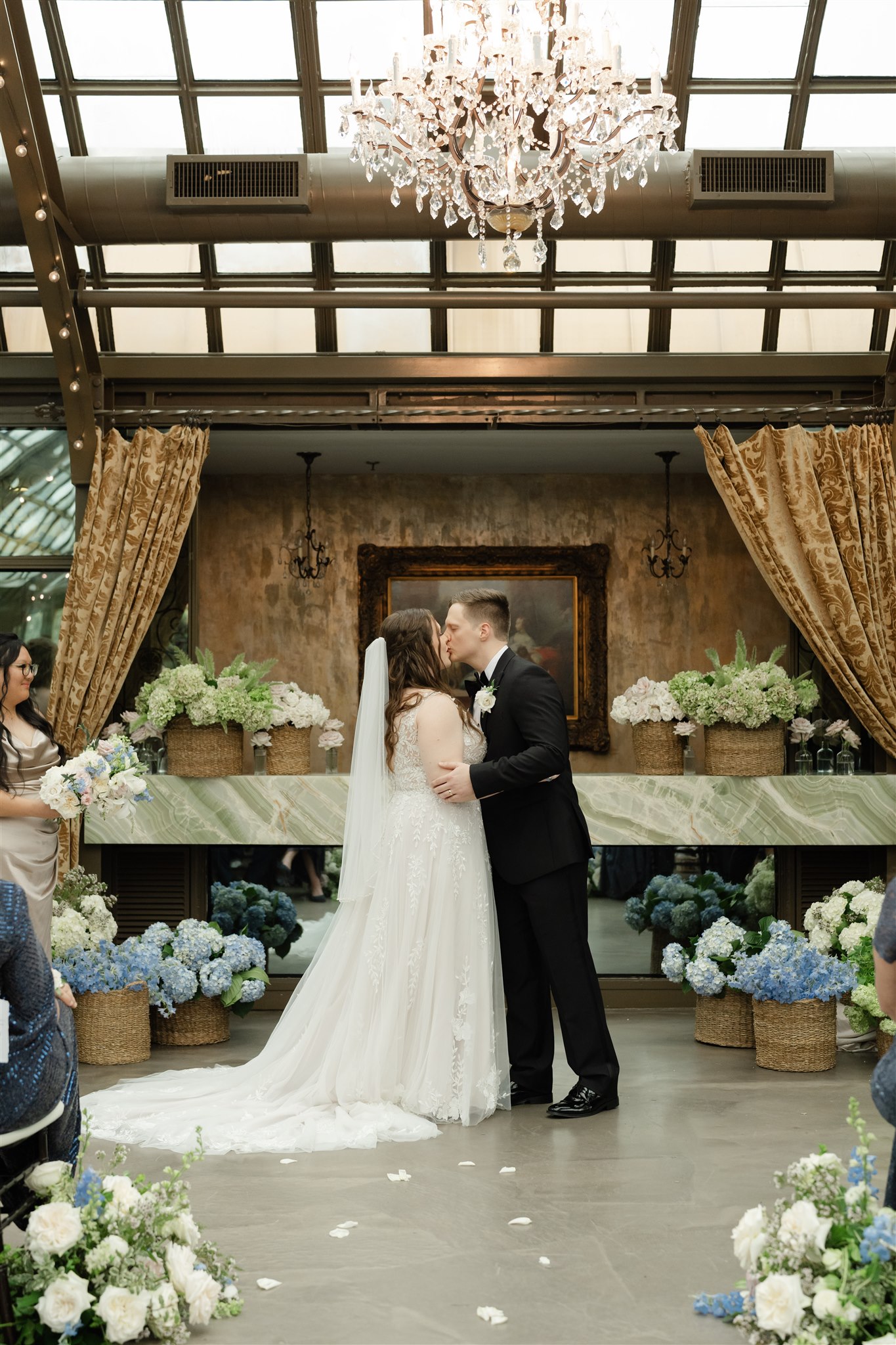 Blue and green flowers in baskets for a wedding ceremony at the bryan museum