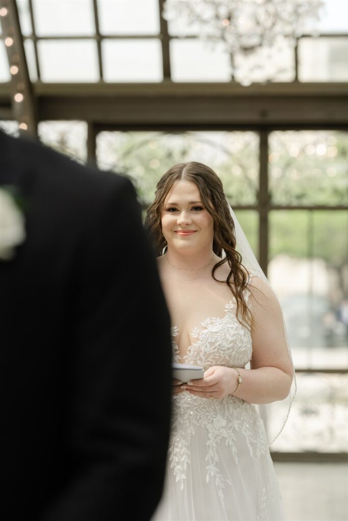 Bride smiling during the emotional first look at The Bryan Museum wedding.