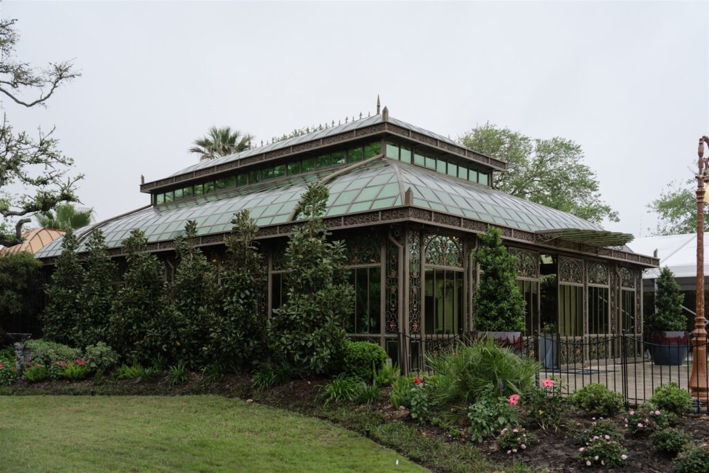 Historic exterior view of The Bryan Museum surrounded by lush gardens, captured before a wedding celebration.