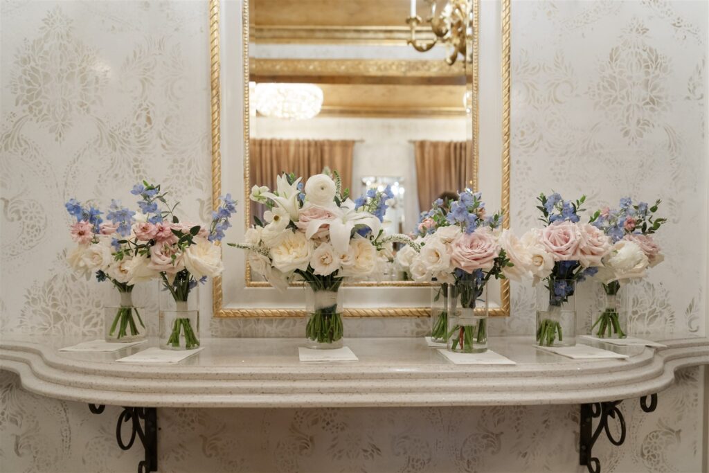 Pastel floral arrangement displayed in an ornate interior space during a wedding at The Bryan Museum.