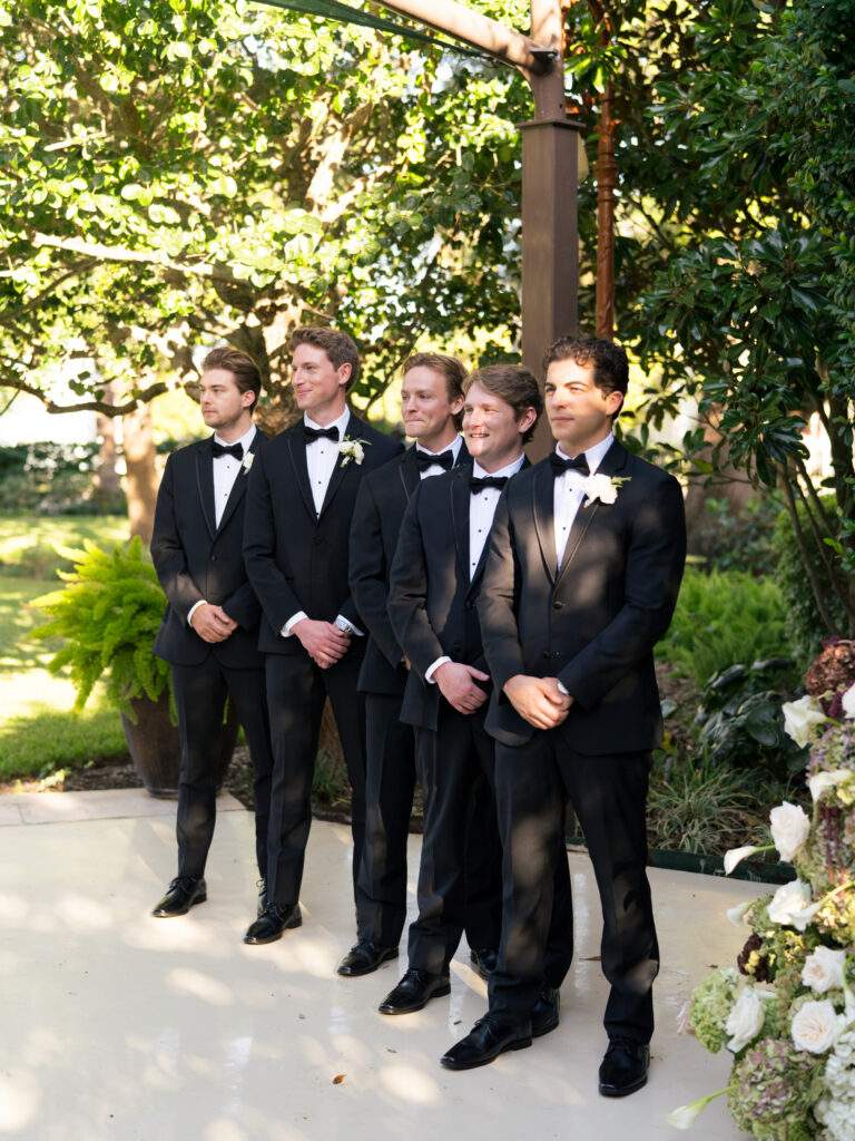 Groomsmen during ceremony at a romantic fall wedding at The Bryan Museum.
