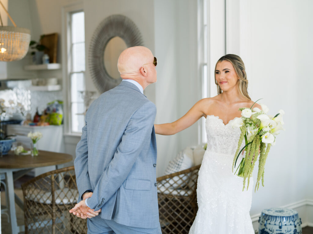 Emotional father and daughter first look moment before a fall wedding ceremony at The Bryan Museum.