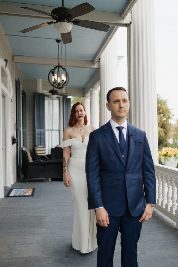 Groom waiting on the historic veranda before his Carr Mansion wedding ceremony.