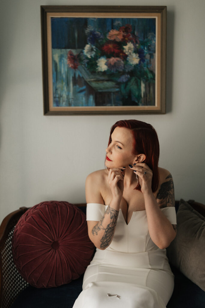 Bride getting ready at Carr Mansion wedding venue with natural window light.